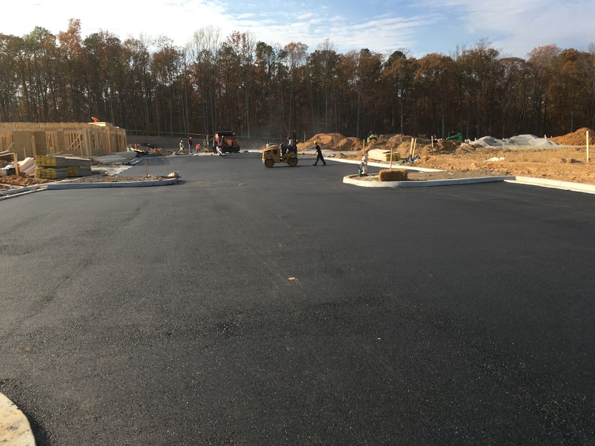Fresh black mat across a Richmond parking lot